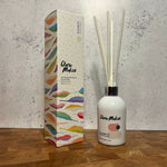 Clare Makes 200ml reed diffuser in a gloss white glass bottle with silver collar and white reeds
