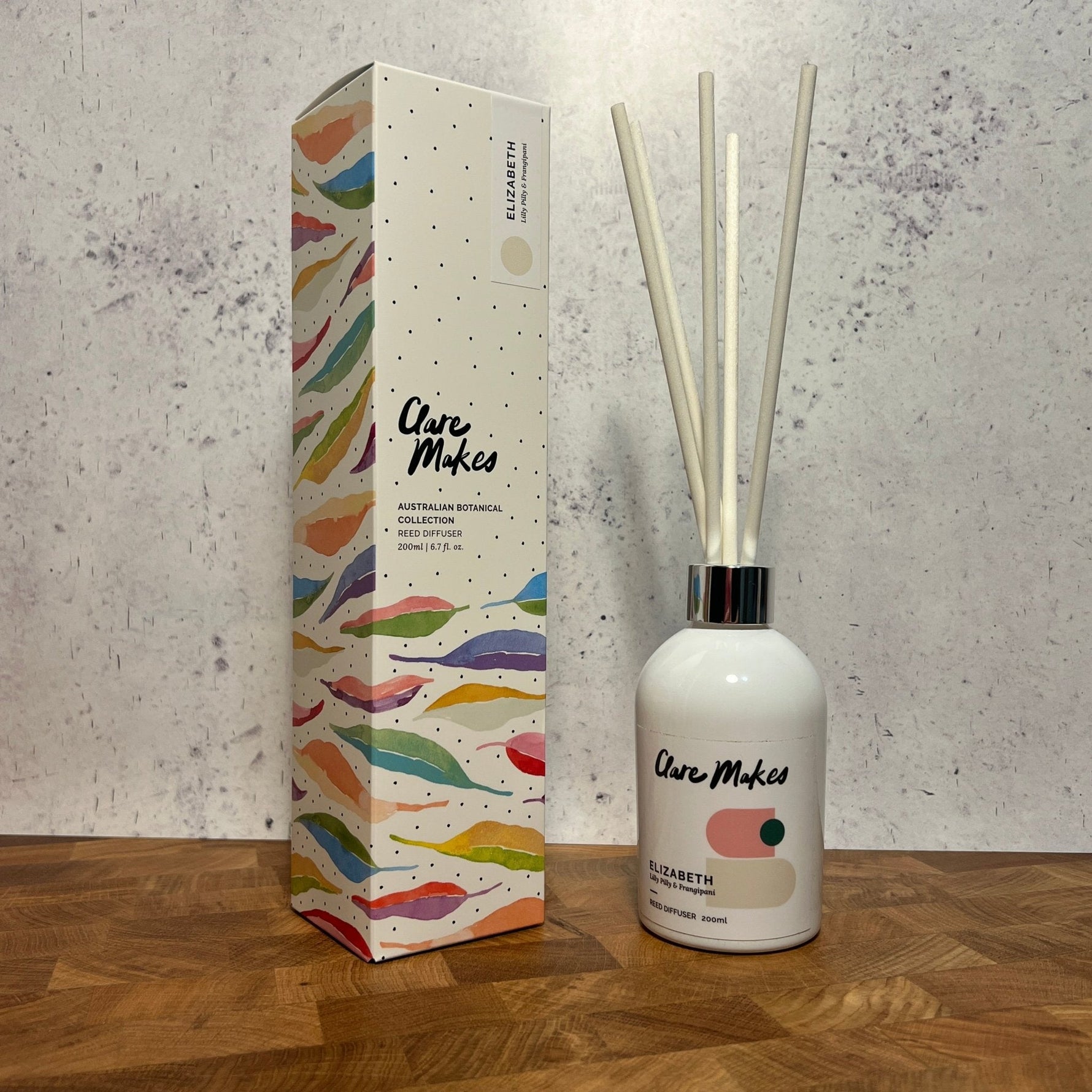 Clare Makes 200ml reed diffuser in a gloss white glass bottle with silver collar and white reeds