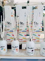 Clare Makes 200ml reed diffuser in a gloss white glass bottle with silver collar and white reeds
