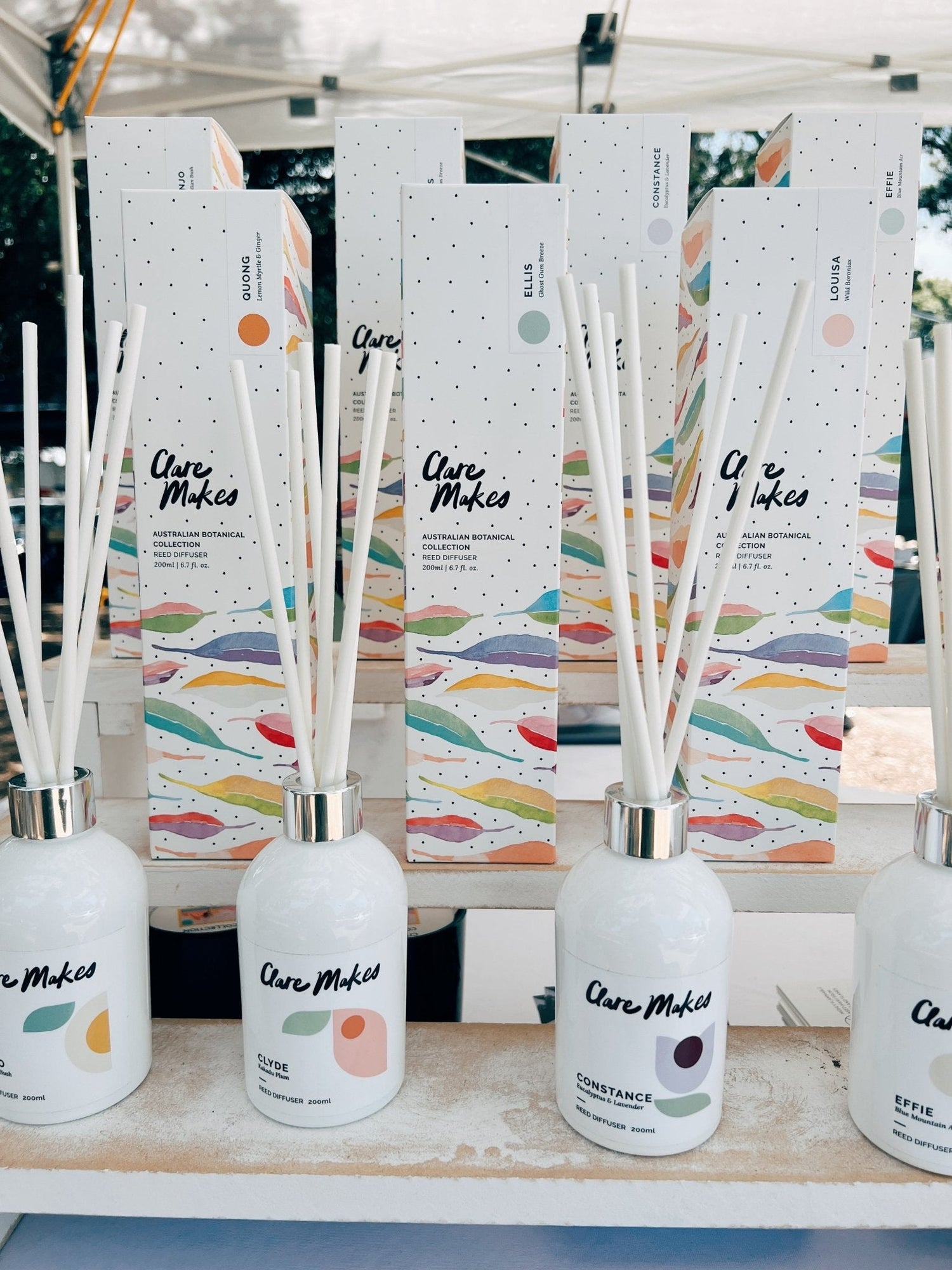 Clare Makes 200ml reed diffuser in a gloss white glass bottle with silver collar and white reeds