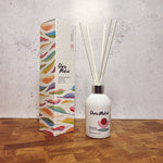 Clare Makes 200ml reed diffuser in a gloss white glass bottle with silver collar and white reeds