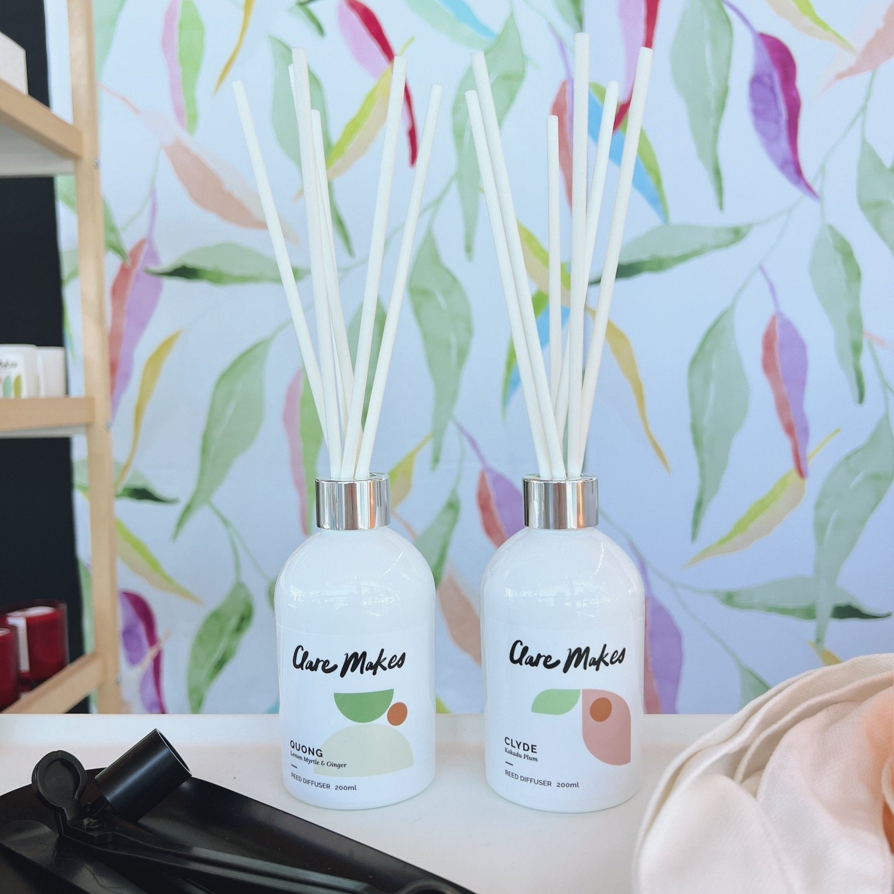 Clare Makes 200ml reed diffuser in a gloss white glass bottle with silver collar and white reeds
