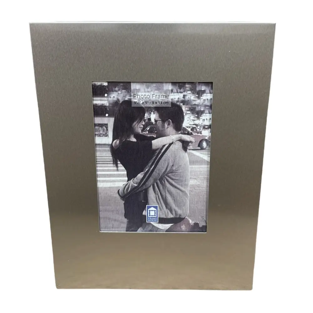 Metallic aluminium photo frame showcasing a black and white romantic photograph