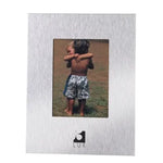 Silver aluminium photo frame showcasing children hugging in a black velvet setting
