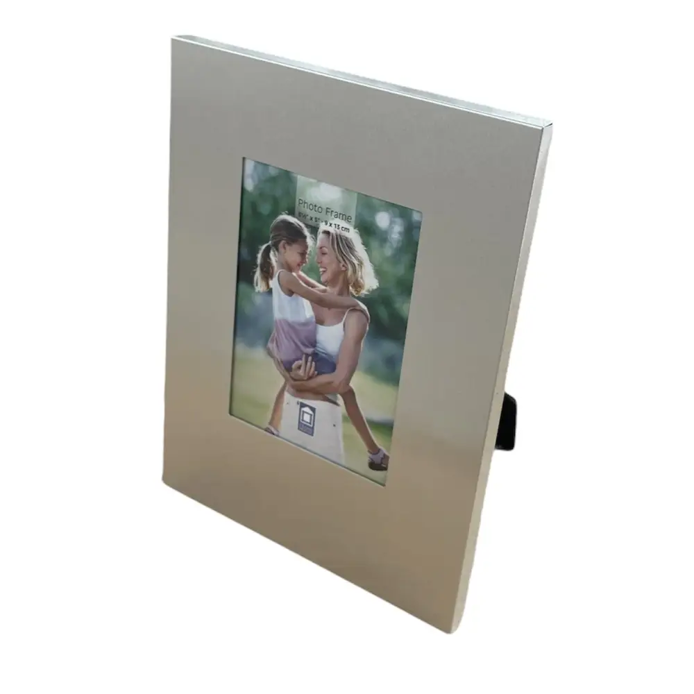 Modern aluminium photo frame displaying a romantic couple’s picture on black velvet
